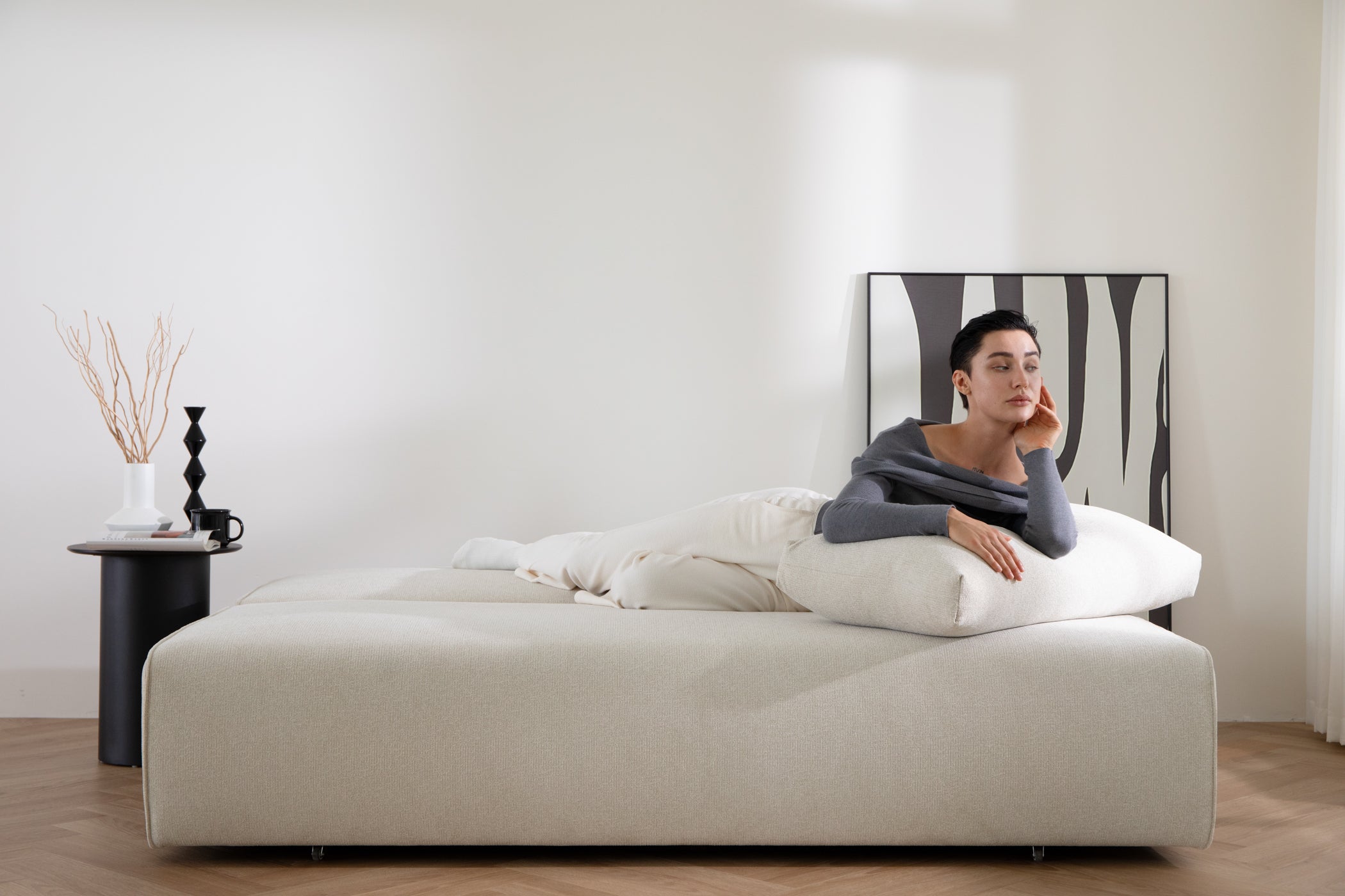 DUNCAN Pearl White Lifetyle With Model Sofa Bed