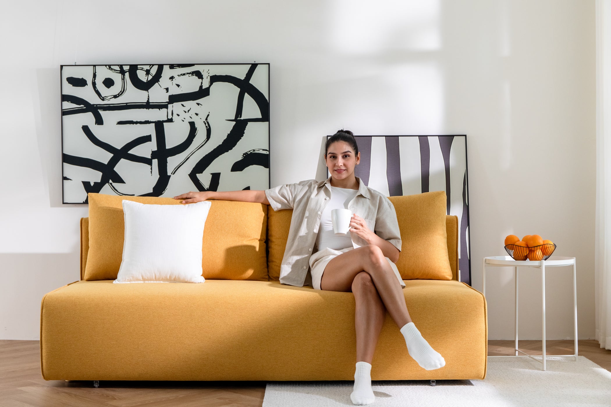 DUNCAN Tuscany Yellow Lifetyle With Model sofa bed